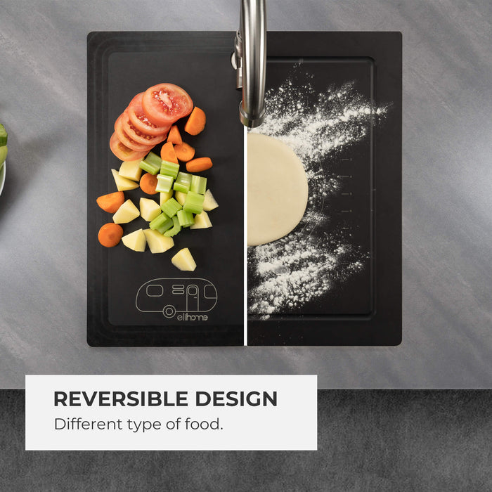 Split view demonstrating the reversible design of the Elihome RV sink cover. The left side shows chopped vegetables next to the RV logo, while the right side shows the board being used for kneading dough over the sink.