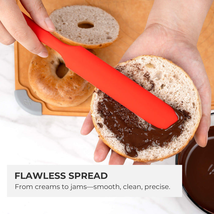 Elihome red silicone jar spatula spreading chocolate on a bagel - durable flexible design for flawless spread from creams to jams, smooth, clean, and precise application