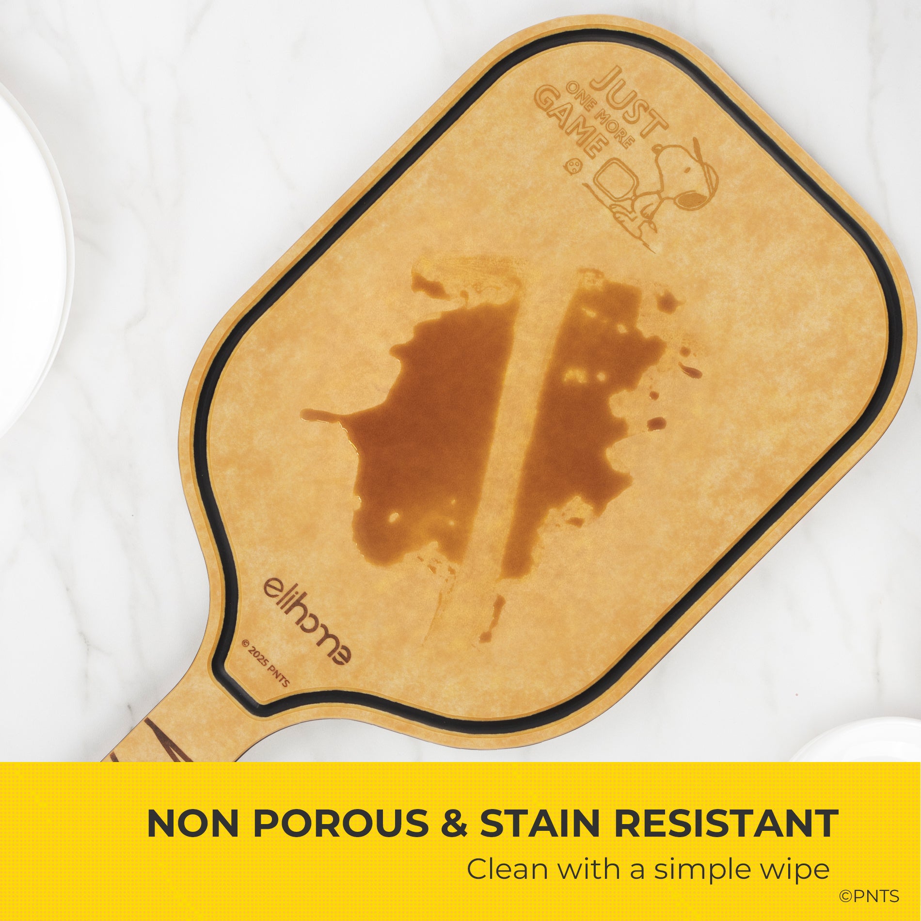Wooden paddle with a stain on a white background, featuring 'Just Game' branding.